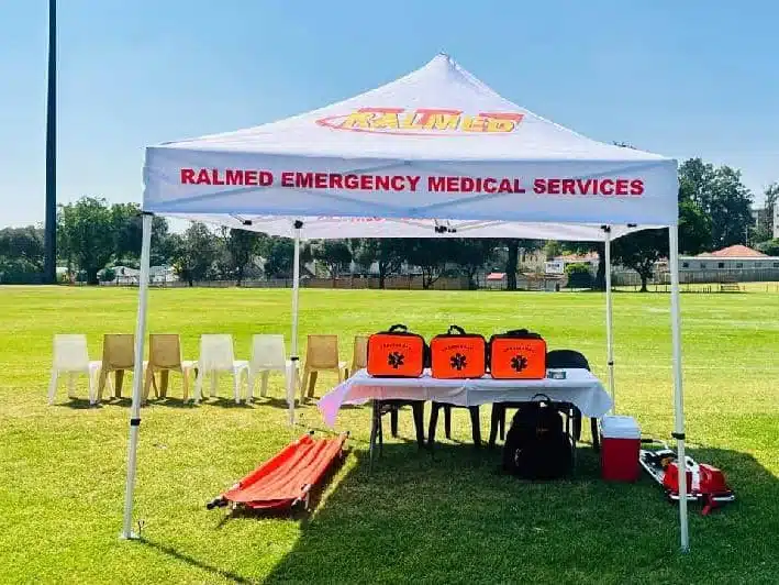 Ralmed emergency medical services tent beside a sports field